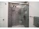Modern bathroom with walk-in shower and pebble floor at 494 Boca Ciega Point N Blvd, St Petersburg, FL 33708