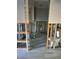 Bathroom under construction with new flooring and exposed framing at 494 Boca Ciega Point N Blvd, St Petersburg, FL 33708