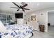 Bright bedroom with a dresser, tv, and comfortable bedding at 494 Boca Ciega Point N Blvd, St Petersburg, FL 33708