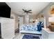 Spacious bedroom with a ceiling fan, dresser, and king-size bed at 494 Boca Ciega Point N Blvd, St Petersburg, FL 33708
