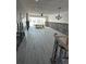 Common area under renovation with new tile flooring and exposed framing at 494 Boca Ciega Point N Blvd, St Petersburg, FL 33708