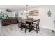 Bright dining area with six chairs and kitchen view at 494 Boca Ciega Point N Blvd, St Petersburg, FL 33708