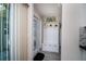 Entryway with bench, coat rack, and tiled floor at 494 Boca Ciega Point N Blvd, St Petersburg, FL 33708