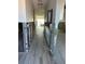 Hallway under renovation with new flooring at 494 Boca Ciega Point N Blvd, St Petersburg, FL 33708