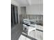 Under renovation lanai with new tile flooring at 494 Boca Ciega Point N Blvd, St Petersburg, FL 33708