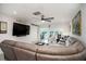 Large living area with sectional sofa and wall-mounted tv at 494 Boca Ciega Point N Blvd, St Petersburg, FL 33708
