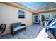 Cozy patio with seating and grill; features a side entrance to the home at 494 Boca Ciega Point N Blvd, St Petersburg, FL 33708
