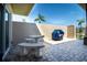 Private patio with table, chairs, and grill, perfect for outdoor dining at 494 Boca Ciega Point N Blvd, St Petersburg, FL 33708