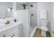 Modern bathroom with white vanity, marble shower, and gold fixtures at 5718 Magnolia N St, St Petersburg, FL 33703