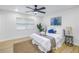 Bright bedroom with a comfortable bed and a large window at 5718 Magnolia N St, St Petersburg, FL 33703