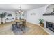 Bright dining room with a wooden table, four chairs, and a modern chandelier at 5718 Magnolia N St, St Petersburg, FL 33703