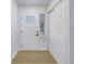 Bright entryway with a white door and built-in storage at 5718 Magnolia N St, St Petersburg, FL 33703