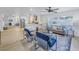 Open concept living and kitchen area with light flooring and modern furniture at 5718 Magnolia N St, St Petersburg, FL 33703