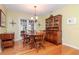 Elegant dining room with hardwood floors and a large wooden hutch at 6005 N 9Th St, Tampa, FL 33604