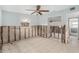 Under-renovation bedroom with exposed walls, tiled floor, and ceiling fan at 6702 Sandra Dr, Port Richey, FL 34668