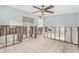 Under-renovation bedroom with exposed walls and tiled floor at 6702 Sandra Dr, Port Richey, FL 34668