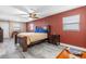 Bright bedroom with wood bed frame and ceiling fan at 7226 Alafia Ridge Loop, Riverview, FL 33569