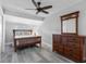 Guest bedroom with wood bed frame and dresser at 7226 Alafia Ridge Loop, Riverview, FL 33569