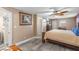 Bedroom with wood bed frame, built-in dresser, and ensuite bathroom access at 7226 Alafia Ridge Loop, Riverview, FL 33569