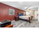 Spacious bedroom with wood bed frame and ceiling fan at 7226 Alafia Ridge Loop, Riverview, FL 33569