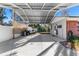 Covered carport with concrete slab and storage area at 7226 Alafia Ridge Loop, Riverview, FL 33569