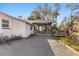 House exterior showcasing a sunroom and river views at 7226 Alafia Ridge Loop, Riverview, FL 33569