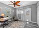 Spacious home office with a desk, chair, and exterior access at 7226 Alafia Ridge Loop, Riverview, FL 33569
