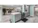 Modern kitchen with gray cabinets, stainless steel appliances, and a large island at 7226 Alafia Ridge Loop, Riverview, FL 33569