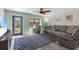 Living area with gray sectional sofa and decorative rug at 7226 Alafia Ridge Loop, Riverview, FL 33569