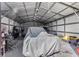 Workshop with covered vehicle and workbench at 7226 Alafia Ridge Loop, Riverview, FL 33569