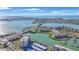 Aerial view of waterfront community with boat docks and bridge at 7400 Sun Island S Dr # 806, South Pasadena, FL 33707