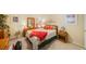 Bedroom with full-size bed, dresser, and workspace at 8403 Annwood Rd, Seminole, FL 33777