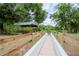 Relaxing community path with a wooden fence and ramp at 1069 River Wind Cir, Bradenton, FL 34212