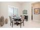 Cozy dining area with a round table and four chairs, perfect for intimate meals at 1069 River Wind Cir, Bradenton, FL 34212
