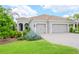 Well-maintained house with three-car garage and lush landscaping at 1069 River Wind Cir, Bradenton, FL 34212