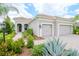 Beautiful home with a three-car garage and nicely landscaped front yard at 1069 River Wind Cir, Bradenton, FL 34212