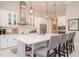 Modern kitchen with white cabinets, stainless steel appliances, and a large island at 1069 River Wind Cir, Bradenton, FL 34212