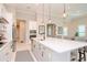 Modern kitchen with white cabinets, stainless steel appliances, and a large island at 1069 River Wind Cir, Bradenton, FL 34212