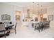 Modern kitchen with white cabinets, stainless steel appliances, and a large island at 1069 River Wind Cir, Bradenton, FL 34212