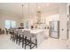 Modern kitchen with white cabinets, stainless steel appliances, and a large island at 1069 River Wind Cir, Bradenton, FL 34212