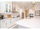 Modern kitchen with white cabinets, stainless steel appliances, and a large island at 1069 River Wind Cir, Bradenton, FL 34212