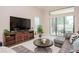 Spacious living area with comfortable seating and large sliding glass doors at 1069 River Wind Cir, Bradenton, FL 34212