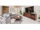 Comfortable living room with a stylish sectional sofa and a large TV at 1069 River Wind Cir, Bradenton, FL 34212