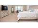 Main bedroom with a king-size bed and large windows at 1069 River Wind Cir, Bradenton, FL 34212