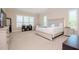 Spacious main bedroom with a large bed and ample natural light at 1069 River Wind Cir, Bradenton, FL 34212