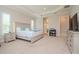 Main bedroom with king bed, ensuite bathroom access, and ample closet space at 1069 River Wind Cir, Bradenton, FL 34212
