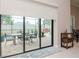 Sliding glass doors that open to a relaxing patio and refreshing pool area at 1069 River Wind Cir, Bradenton, FL 34212