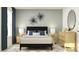 Bedroom with wood bed frame, dresser, and stylish decor at 13248 Empress Jewel Trl, Parrish, FL 34219