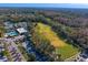 Aerial view of golf course and clubhouse at 15890 Sanctuary Dr, Tampa, FL 33647