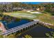Aerial view of a golf course with bridge at 15890 Sanctuary Dr, Tampa, FL 33647